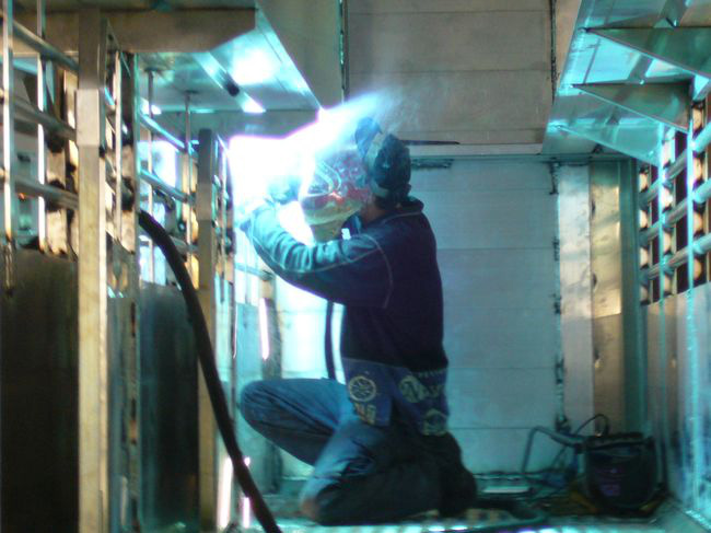 Image of an operator welding aluminum